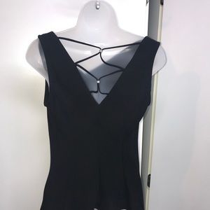 Black drape top and pleated hem skirt